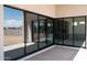 Covered patio with sliding glass doors leading to the kitchen at 20503 E Indiana Ave, Queen Creek, AZ 85142