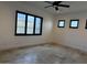 Bedroom with large window and tile floors at 21430 W Glen St, Buckeye, AZ 85396