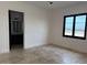 Spacious bedroom with large windows and an ensuite bathroom at 21430 W Glen St, Buckeye, AZ 85396