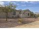 Stunning home exterior with mountain views and desert landscaping at 21430 W Glen St, Buckeye, AZ 85396