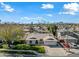 Aerial view of a single-story home with a two-car garage and landscaped yard at 2244 S Estrella Cir, Mesa, AZ 85202