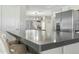 Kitchen island view with seating and stainless steel fridge at 2244 S Estrella Cir, Mesa, AZ 85202