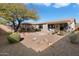 Spacious backyard with gravel and stone patio at 2327 W Firethorn Way, Anthem, AZ 85086