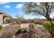 Desert landscaping with patio and seating area at 2327 W Firethorn Way, Anthem, AZ 85086