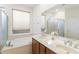 Bathroom boasts a large soaking tub, double vanity, and a walk-in shower at 2327 W Firethorn Way, Anthem, AZ 85086
