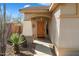 Inviting entryway with wood door and pathway leading to the front door at 2327 W Firethorn Way, Anthem, AZ 85086