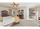 Main bedroom features a king bed, large windows, and patio access at 2327 W Firethorn Way, Anthem, AZ 85086