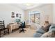 Home office with desk, chair, and comfortable seating area at 2327 W Firethorn Way, Anthem, AZ 85086