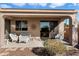 Covered patio with seating area, perfect for relaxing outdoors at 2327 W Firethorn Way, Anthem, AZ 85086