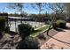 Outdoor pickleball court with shade structures and well-maintained landscaping at 2327 W Firethorn Way, Anthem, AZ 85086