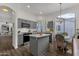 Modern kitchen with gray cabinets, island, and stainless steel appliances at 23705 S Pleasant Way, Sun Lakes, AZ 85248