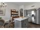 Modern kitchen with gray cabinets and an island at 23705 S Pleasant Way, Sun Lakes, AZ 85248