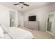 Bright bedroom with large dresser and a full-length mirror at 25151 N 143Rd Dr, Surprise, AZ 85387