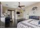 Main bedroom with dark floors and a fireplace at 2670 E Wisteria Dr, Chandler, AZ 85286