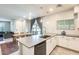 Modern kitchen with white cabinets, large island, and subway tile backsplash at 2722 S Cavalier Dr # 102, Gilbert, AZ 85295