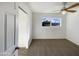 Simple bedroom with carpet flooring and window view at 310 W Aspen Ave, Gilbert, AZ 85233