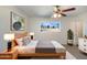 Spacious bedroom with wood bed frame and modern decor at 310 W Aspen Ave, Gilbert, AZ 85233