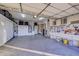 Organized garage with overhead storage and workbench at 35167 N 92Nd Pl, Scottsdale, AZ 85262