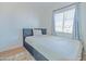 Cozy bedroom with double bed and window coverings at 3605 W Bethany Home Rd # 10, Phoenix, AZ 85019