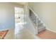 Entryway with carpeted staircase and view of kitchen at 3605 W Bethany Home Rd # 10, Phoenix, AZ 85019