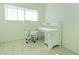 Bright home office features built-in desk and chair at 3605 W Bethany Home Rd # 10, Phoenix, AZ 85019