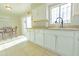 Kitchen features white cabinets, granite counters, and a breakfast nook at 3605 W Bethany Home Rd # 10, Phoenix, AZ 85019