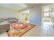 Living room with brown sectional sofa and red area rug at 3605 W Bethany Home Rd # 10, Phoenix, AZ 85019