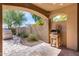 Covered patio with built-in grill, outdoor kitchen, and stone flooring at 3773 E Donald Dr, Phoenix, AZ 85050