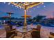 Relaxing backyard patio with pool, pergola, and outdoor seating at 3773 E Donald Dr, Phoenix, AZ 85050