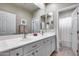 Bright bathroom with double sinks, white cabinets, and shower at 3773 E Donald Dr, Phoenix, AZ 85050