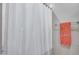 Shower stall with white curtain and coral towel at 3773 E Donald Dr, Phoenix, AZ 85050