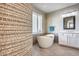 Spa-like bathroom with soaking tub and walk-in shower at 3773 E Donald Dr, Phoenix, AZ 85050
