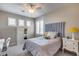 Cozy bedroom with a comfortable bed and plenty of light at 3773 E Donald Dr, Phoenix, AZ 85050