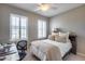 Bedroom with double bed, desk and neutral tones at 3773 E Donald Dr, Phoenix, AZ 85050