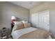 Bedroom with a double bed and built-in closet at 3773 E Donald Dr, Phoenix, AZ 85050