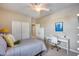 Bedroom with bed, desk, and built-in closet at 3773 E Donald Dr, Phoenix, AZ 85050