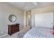 Well-lit bedroom with a double bed and dresser at 3773 E Donald Dr, Phoenix, AZ 85050