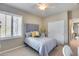 Bright bedroom with double bed, closet, and window at 3773 E Donald Dr, Phoenix, AZ 85050