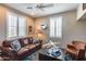 Relaxing den with leather seating and airplane decor at 3773 E Donald Dr, Phoenix, AZ 85050