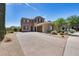 Beautiful two-story home with stone exterior and landscaped front yard at 3773 E Donald Dr, Phoenix, AZ 85050