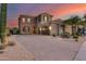 Stunning two-story home with stone accents and a three-car garage at 3773 E Donald Dr, Phoenix, AZ 85050