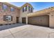 Two story home with stone exterior and a two car garage at 3773 E Donald Dr, Phoenix, AZ 85050