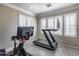 Home gym with Peloton bike and treadmill at 3773 E Donald Dr, Phoenix, AZ 85050