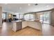 Spacious kitchen with island, stainless steel appliances, and access to backyard at 3773 E Donald Dr, Phoenix, AZ 85050