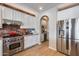 Stylish kitchen features stainless steel appliances and brick backsplash at 3773 E Donald Dr, Phoenix, AZ 85050