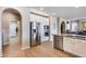 Modern kitchen with stainless steel appliances and white cabinetry at 3773 E Donald Dr, Phoenix, AZ 85050
