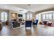 Open living space with hardwood floors and a fireplace at 3773 E Donald Dr, Phoenix, AZ 85050