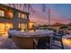 Large outdoor bar with seating overlooking the pool at 3773 E Donald Dr, Phoenix, AZ 85050