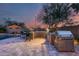 Custom outdoor kitchen with grill and bar seating at 3773 E Donald Dr, Phoenix, AZ 85050