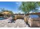 Outdoor kitchen with grill, bar seating, and stone countertops at 3773 E Donald Dr, Phoenix, AZ 85050